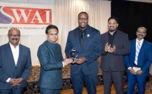 ISWAI Inaugural Social impact Award presented to Mr Jahmal Cole.